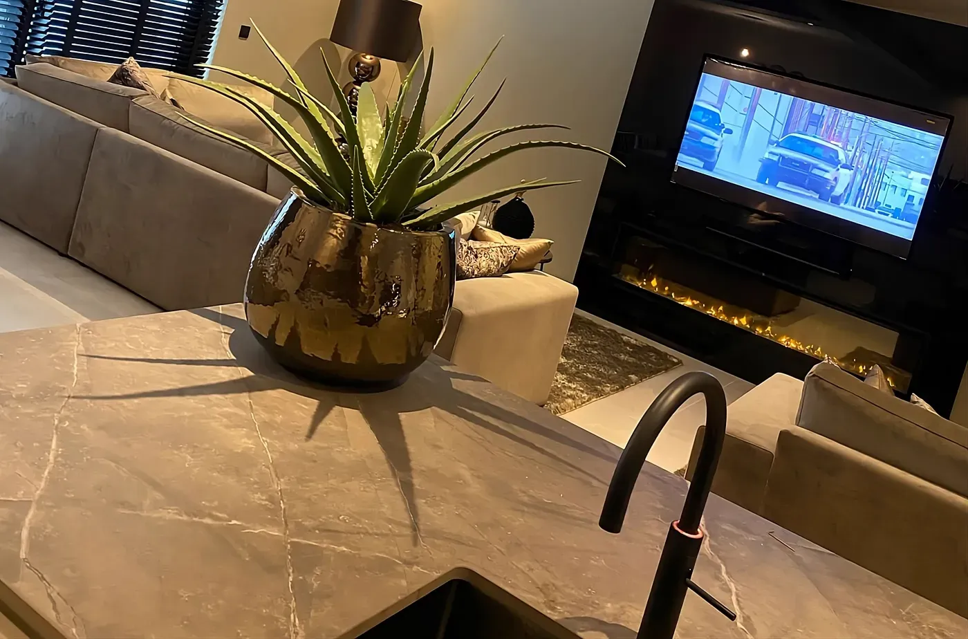 Kitchen and breakfast area with morning light and natural stone surfaces