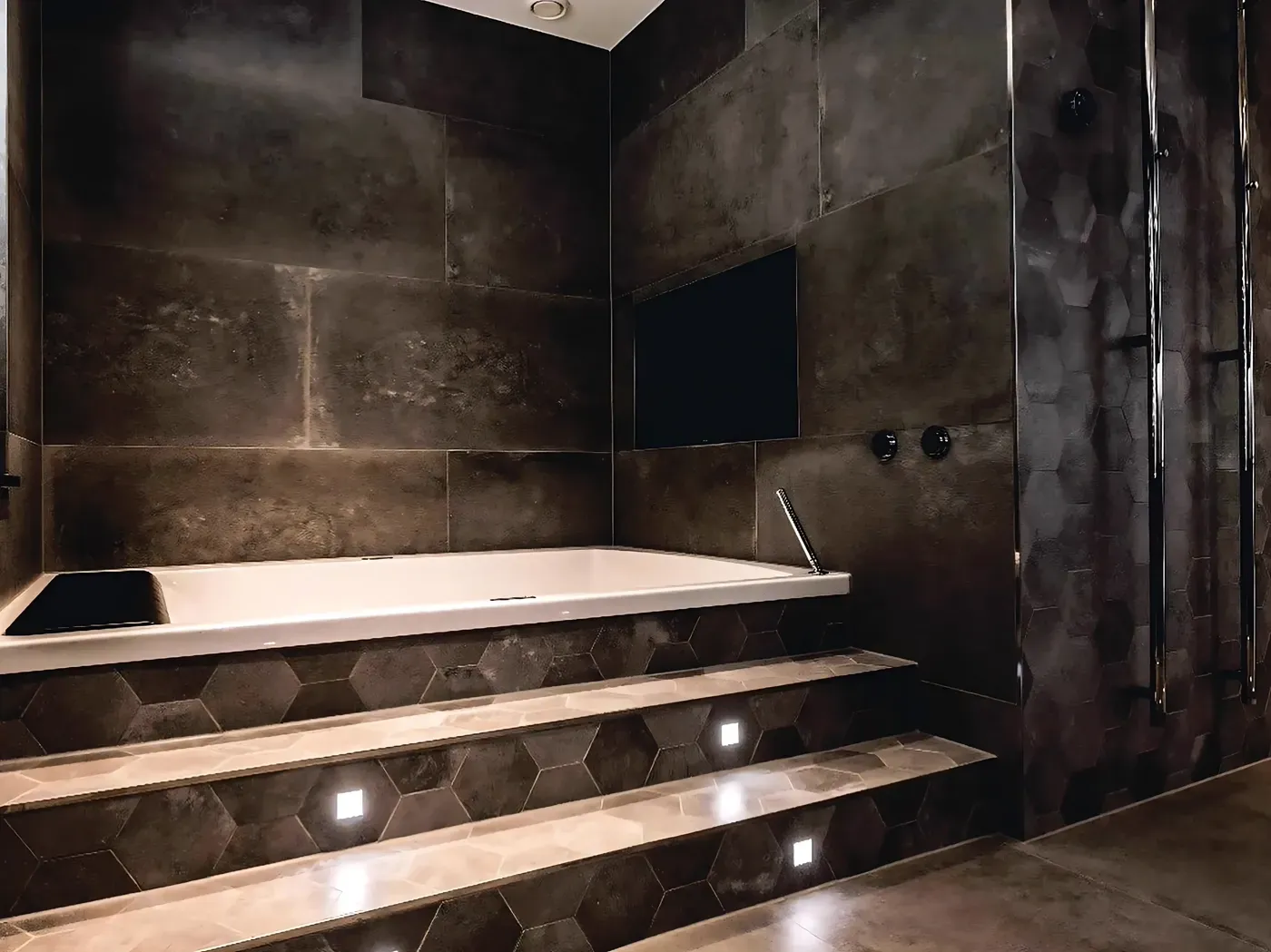 Bathroom with natural stone surfaces and brass fixtures